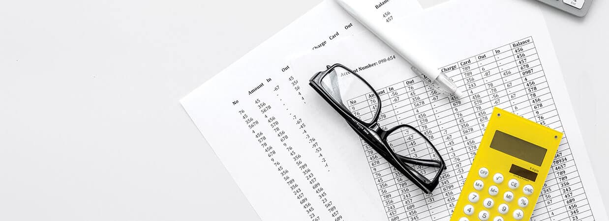 spreadsheet and yellow calculator